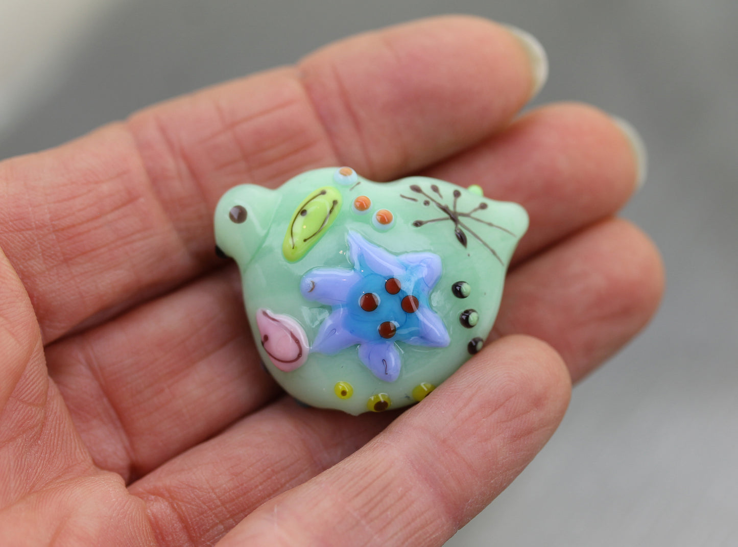 Shiny mint green Miro bird focal bead #2503837