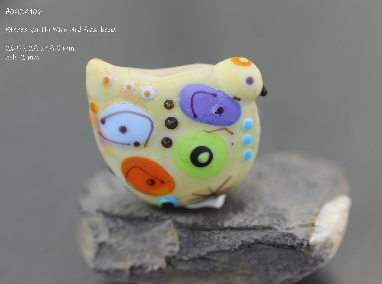 Pale pastel yellow Miro lampwork glass bird bead