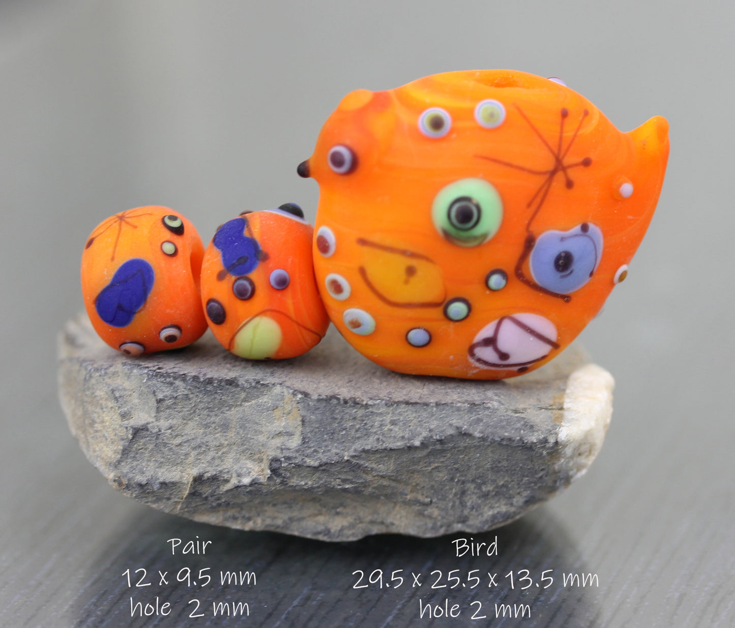 #124 Miro orange bead pair