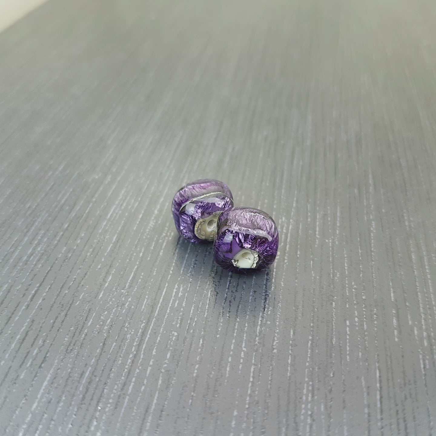 sparkling purple lampwork glass bead pair shaped like cubes or dice 
