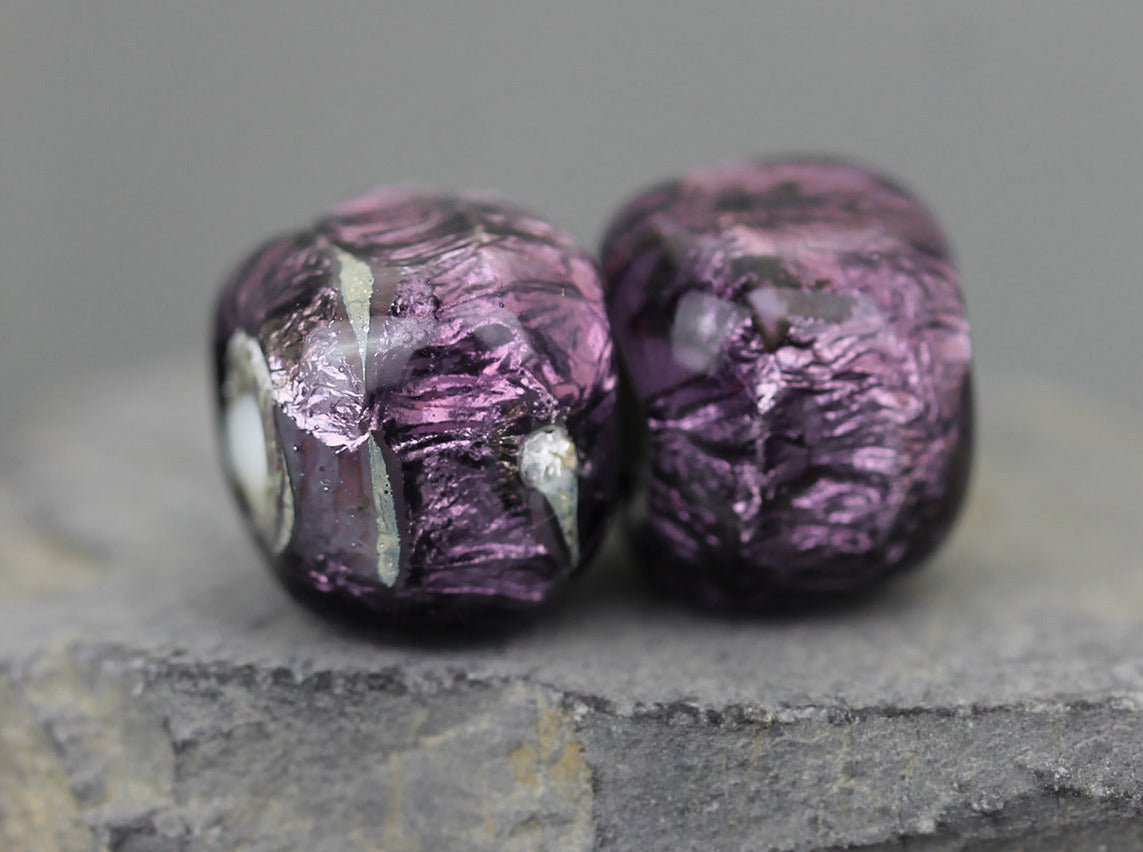 sparkling purple lampwork glass bead pair shaped like cubes or dice 