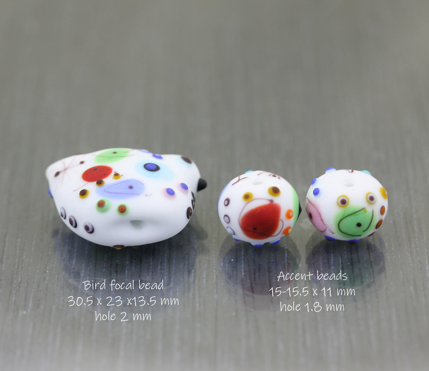 etched white bird lampwork glass beads with a fun colorful pattern with measurements